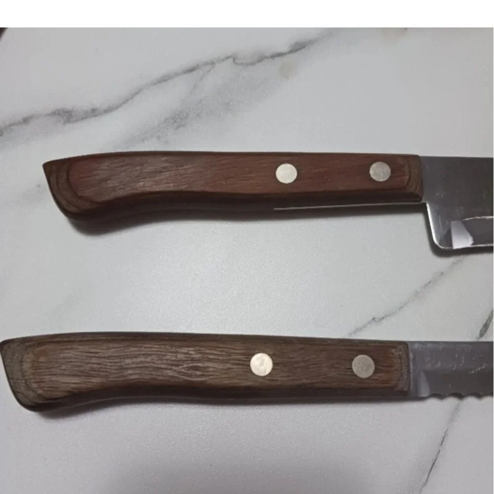 Pair of stainless steel Knives by Flint made in USA Surface scratches Partial